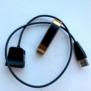Fitbit Alta with gold band and charger